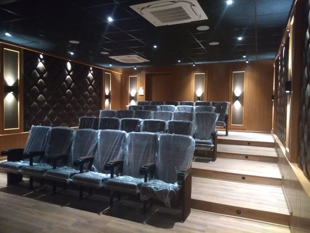 Private Preview Theater with Diamond Quilted Leather Acoustic Walls and Sconce Lights