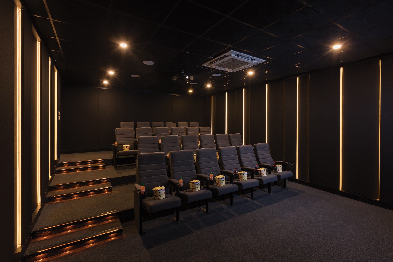 Tiered Cinema Viewing Suite with Illuminated Riser Stairs and Overhead Projector