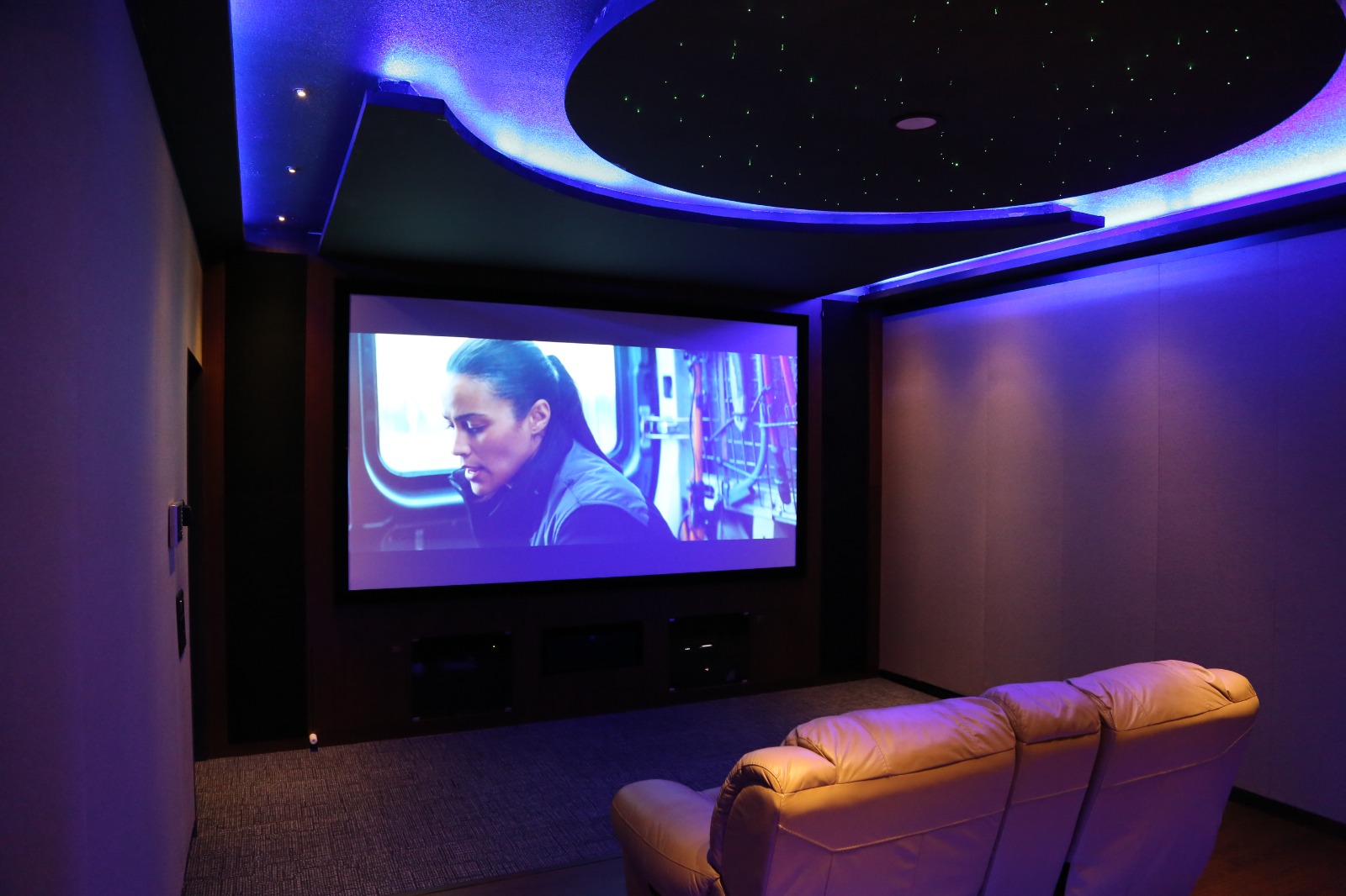 Private Screening Room with Blue LED Cove Lighting and Celestial Star Ceiling